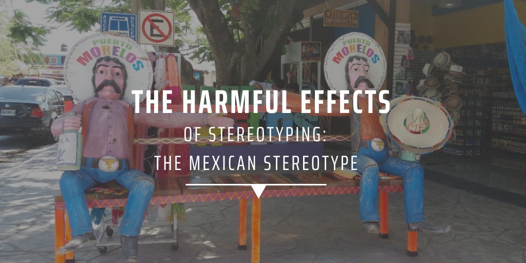 A bench in Mexico depicting two Mexican men in traditional dress on either end.